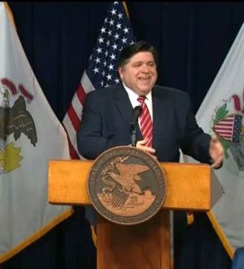 Gov. JB Pritzker takes questions from reporters Friday during his 82nd daily COVID-19 briefing in Chicago. The governor announced he will no longer hold the briefings on each week day, but will call them on an as needed basis going forward. (Credit: BlueRoomStream.comn)