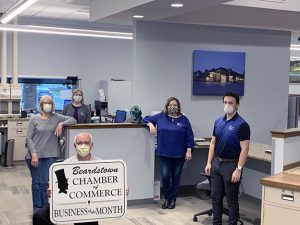 Taking safety precautions at First National Bank, which was named Business of the Month, are Steve Dyche, Ruth Fischer, Janie Ward, Karen Gutman, and Luis Riofrio.