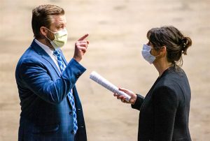 Rep. Kelly M. Burke, D-Evergreen Park, talks with Rep. C.D. Davidsmeyer, R-Jacksonville, after SB 2135, a bill which makes changes to government operations due to the COVID-19 pandemic, Saturday during an extended session of the Illinois House of Representatives at the Bank of Springfield Center in Springfield. (Pool photo by Justin L. Fowler/The State Journal-Register)