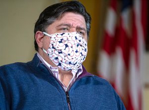 Gov. JB Pritzker faced a number of questions from news media throughout the state Thursday on issues ranging from youth sports activities to worship services.  (Pool photograph by Justin Fowler of the State Journal-Register of Springfield)