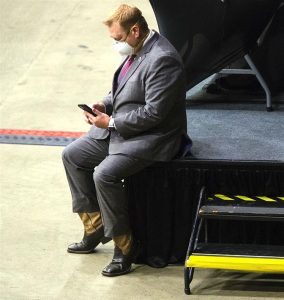 Rep. Allen Skillicorn, R-East Dundee, passes the time looking his phone during debate on vote-by-mail legislation during the spring legislative session Thursday at the Bank of Springfield Center in Springfield. Skillicorn on Tuesday announced he has formally begun the process of attempting to recall Gov. JB Pritzker from office for his handling of problems with the state’s unemployment claims website amid stay-at-home order and subsequent economic downtown. (Ted Schurter/The State Journal-Register)