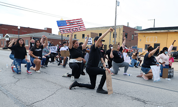 A group of about 50 protesters took to the streets of Beardstown June 3. The march ended with the group kneeling in the street for eight minutes, 46 seconds to represent the last moments of Minnesota resident George Floyd’s life as he lay handcuffed with a police officer’s knee on his neck. (Photo by Brian DeLoche) For more photos go to News/ Photos Gallery.