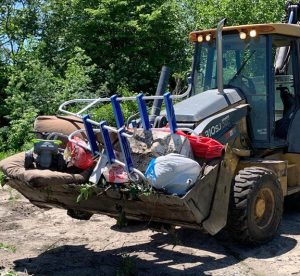 Beardstown city employees removed trash items from the town’s yard-waste dump site this week.