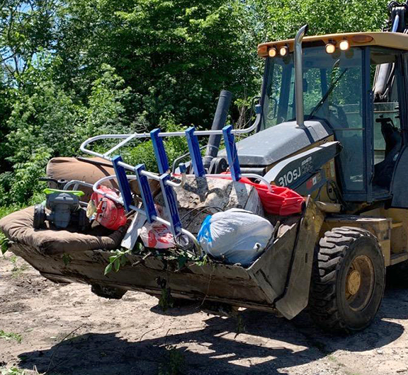 Beardstown city employees removed trash items from the town’s yard-waste dump site this week.
