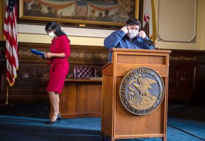FILE PHOTO: Gov. JB Pritzker and Illinois Department of Public Health Director Dr. Ngozi Ezike get ready to begin a news conference May 21 in the governor's office at the Capitol in Springfield. (File photo by Justin L. Fowler of the State Journal-Register in Springfield)