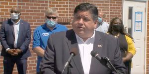 Gov. JB Pritzker announces the expansion of two programs that provide financial relief to low-income families and individuals, including those impacted by the COVID-19 pandemic, during a public appearance Monday in Belleville. (Credit: blueroomstream.com)
