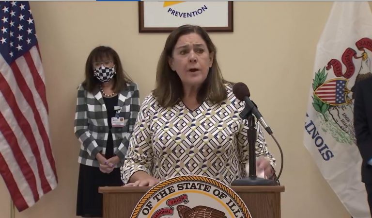 Sen. Jil Tracy, R-Quincy, urges Illinoisans to wear a face covering to prevent the spread of the novel coronavirus. She spoke at a news conference Monday at the Adams County Health Department in Quincy with Gov. JB Pritzker to urge caution in dealing with the virus. (Credit: illinois.gov