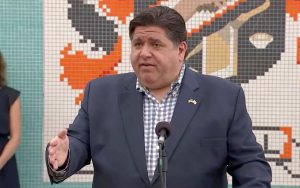 Gov. JB Pritzker speaks Monday during a press event in Peoria. The governor on Monday voiced his support for efforts by the mayors in Springfield and Chicago to enact policies aimed at limiting the spread of COVID-19 at bars. (Credit: blueroomstream.com)