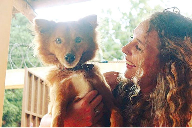 Homeward bound — Beardstown’s Audra Elam is pictured with her dog “Socrates” in a photo taken in Togo, where she served as a Peace Corps volunteer (Photo submitted.)