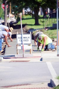 A new way to school — Children residing east of Wall Street will have a safer walk to school on a new sidewalk being constructed between 8th Street and 15th Street.  The new walkway is being constructed with grant funding. (Photo by Brian DeLoche.)
