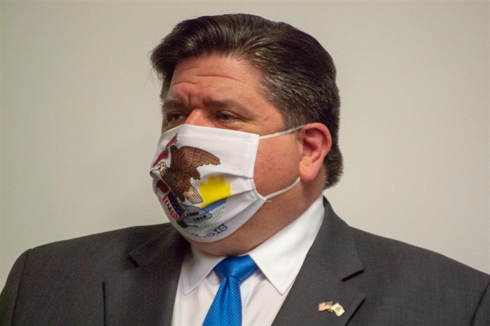 Gov. JB Pritzker wears an Illinois-themes mask as he waits to speak at the Emergency Management Agency Operations Center in Springfield in Springfield Monday. He announced a new $5 million ad campaign to promote face coverings as cases of COVID-19 are on the rise in the state. (Capitol News Illinois photo by Jerry Nowicki)