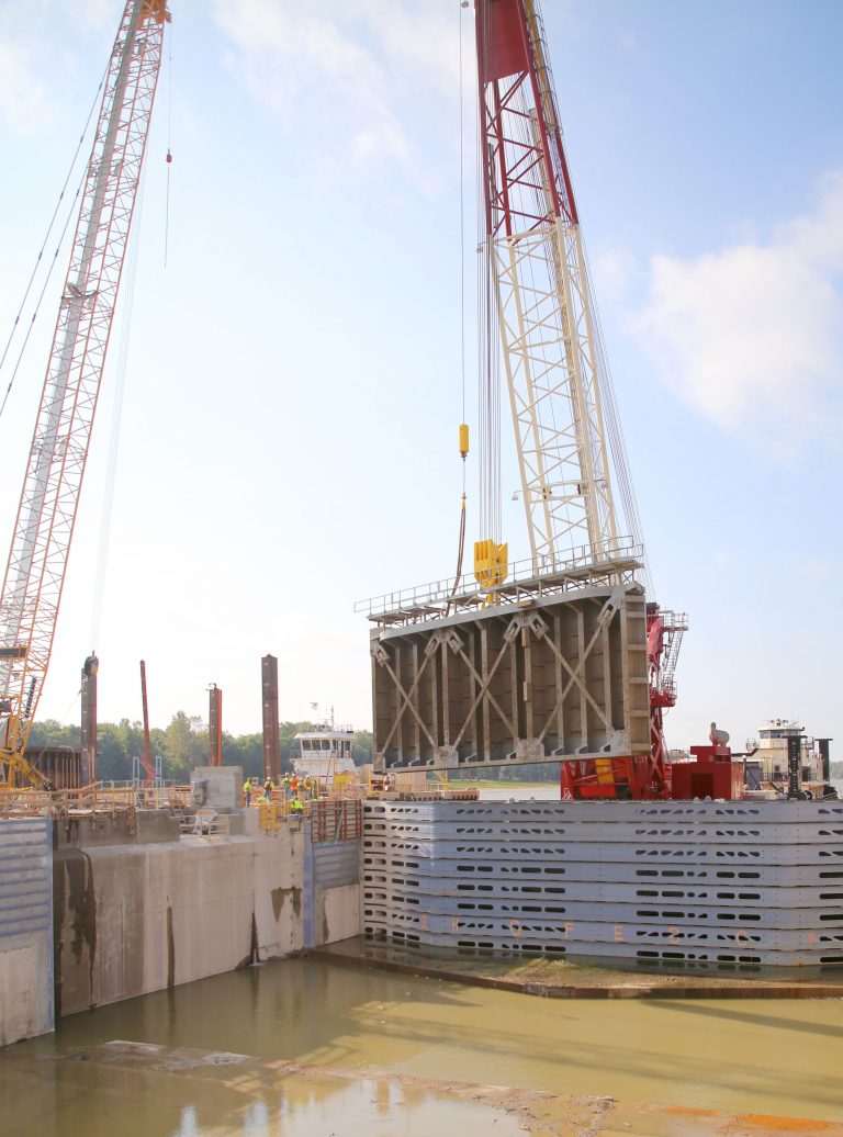 One big, heavy gate, one bigger heavier crane — The first of four new miter gates was lowered into position at the LaGrange Lock Saturday morning. The gate measuring 63 feet wide and 24 feet tall and weighing 110 tons, was lowered into place by a $33 million crane capable of lifting one million pounds. (Photo by Brian DeLoche)