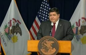 Gov. JB Pritzker speaks at his daily COVID-19 briefing in Chicago Tuesday after reporting that the state would issue a stricter level of COVID-19 mitigations beginning Friday. (Credit: Blueroomstream.com)
