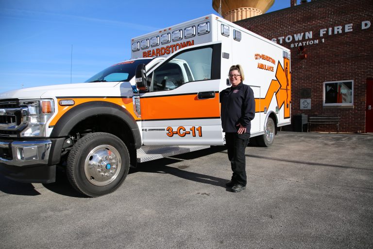 New wheels — Heather Clayton, an EMT with Beardstown Ambulance, is pictured with the department’s new, 4-wheel drive ambulance that was delivered last week. (photo by Brian DeLoche)