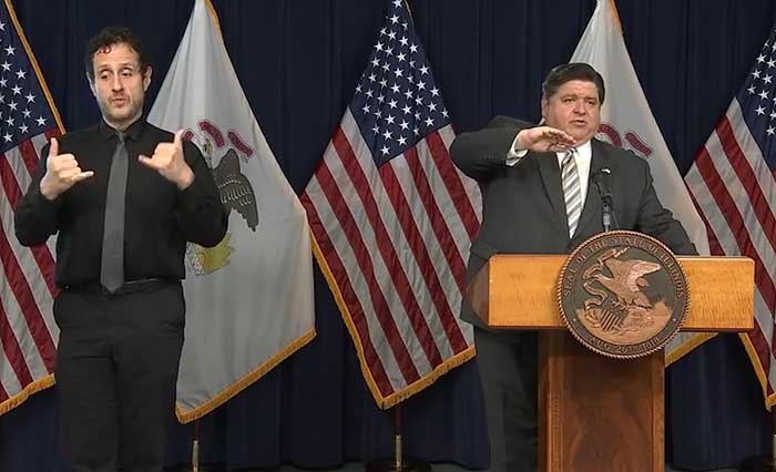 Gov. JB Pritzker tells reporters during a news conference Monday in Chicago that the COVID-19  situation in the northwest region of Illinois is impacted by sharing borders with Iowa and Wisconsin, states where positivity rates are higher. (Credit: facebook.com)