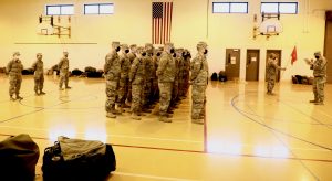 Roll Call — SFC David Perdew takes roll Saturday morning as soldiers arrived to begin preparations for Sunday’s departure.