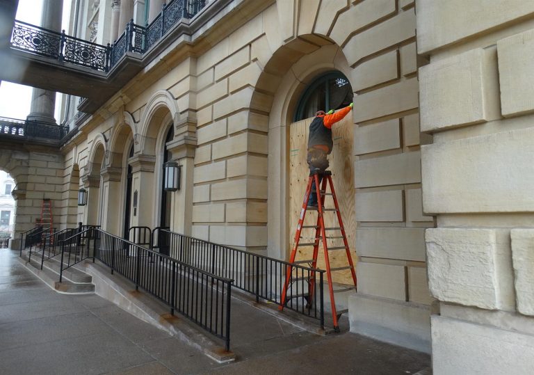 Gov. JB Pritzker has activated 250 members of the Illinois National Guard amid FBI warnings of potential armed protests at the 50 U.S. state capitols in the days leading up to President-elect Joe Biden’s inauguration.  Crews on Friday were placing plywood over the windows of the Illinois State Capitol building in Springfield.