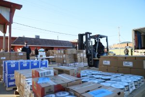 Filling the need — DOT Foods donated more than 8,290 pounds of food for last Saturday’s food give-away at the Beardstown Elks Club. From frozen dairy products to dry goods like pasta and cereal, volunteers were kept busy emptying the 17 pallets of groceries.     (Photo by Brian DeLoche)