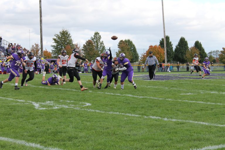 Senior QB Jacob Pate throws on the run