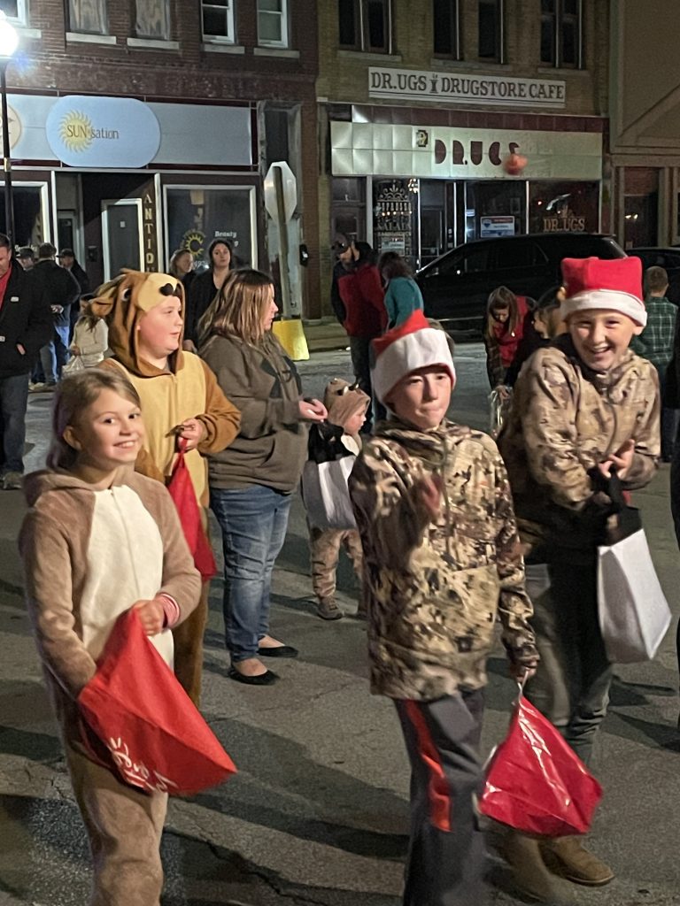 Santa’s elves toss candy