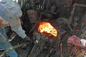 A fireman shoveling coal