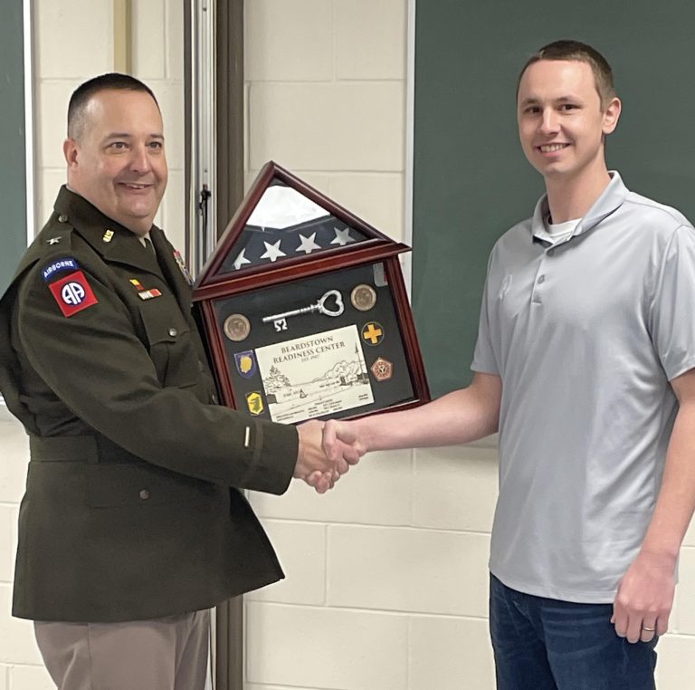 Brig. General Mark Alessia presents a ceremonial key to Beardstown Park Director Deion Summers at a ceremony held Tuesday at the Beardstown Armory.