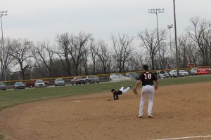 Tiger shortstop William Davidsmeier makes a diving attempt at a ground ball in the hole in a victory over Rushville at home.    Photo by Jason Brockschmidt