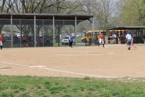 Third baseman Shelby Goodrich of the Lady Tigers awaits the throw as a Lady Bulldog from Decatur St. Teresa advances to third in home softball action.   Photo by Jason Brockschmidt