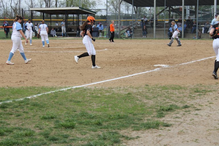 Beardstown freshman Bella Palmer gets ready to touch third base on her way home following her home run against Triopia recently.  Photo by Jason Brockschmidt