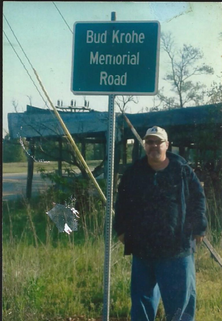 Tobie Krohe with sign honoring his father, Bud Krohe.     Photo submitted