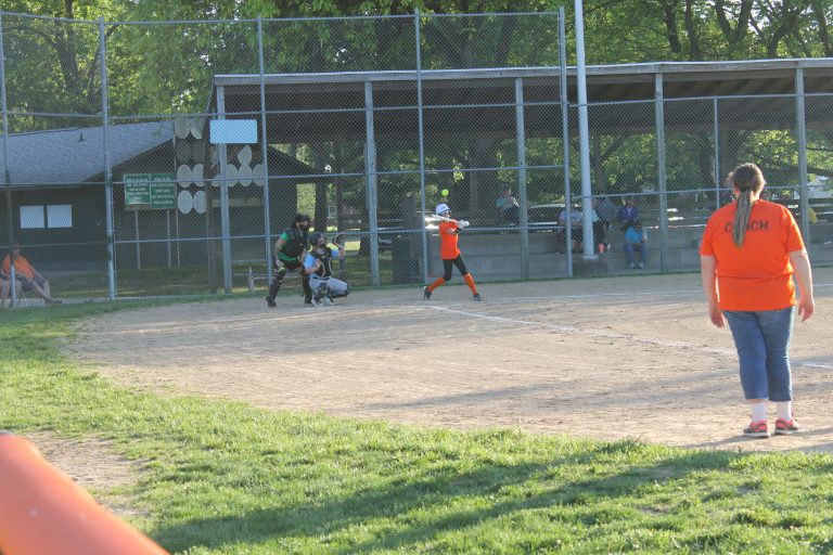 Addilynn Tracy, representing Tyson’s, drives a high fastball to deep right field in a Little League girls softball game against Tri-County at Bruce Rice Field in Beardstown.				  Photo by Jason Brockschmidt