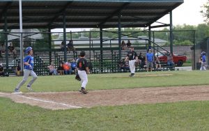 Tycen Little of the Beardstown Fire Department Blue Jays rounds first base following a base hit against the O’Hara Autoglass Pirates in Little League baseball action.
