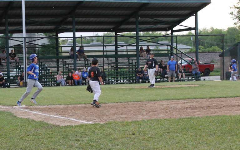 Tycen Little of the Beardstown Fire Department Blue Jays rounds first base following a base hit against the O’Hara Autoglass Pirates in Little League baseball action.