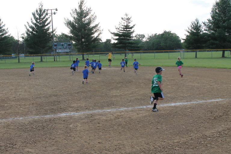 The chase is on!  All of the defense is in hot pursuit of the ball at a Beardstown Park District t-ball game at Jones Field.