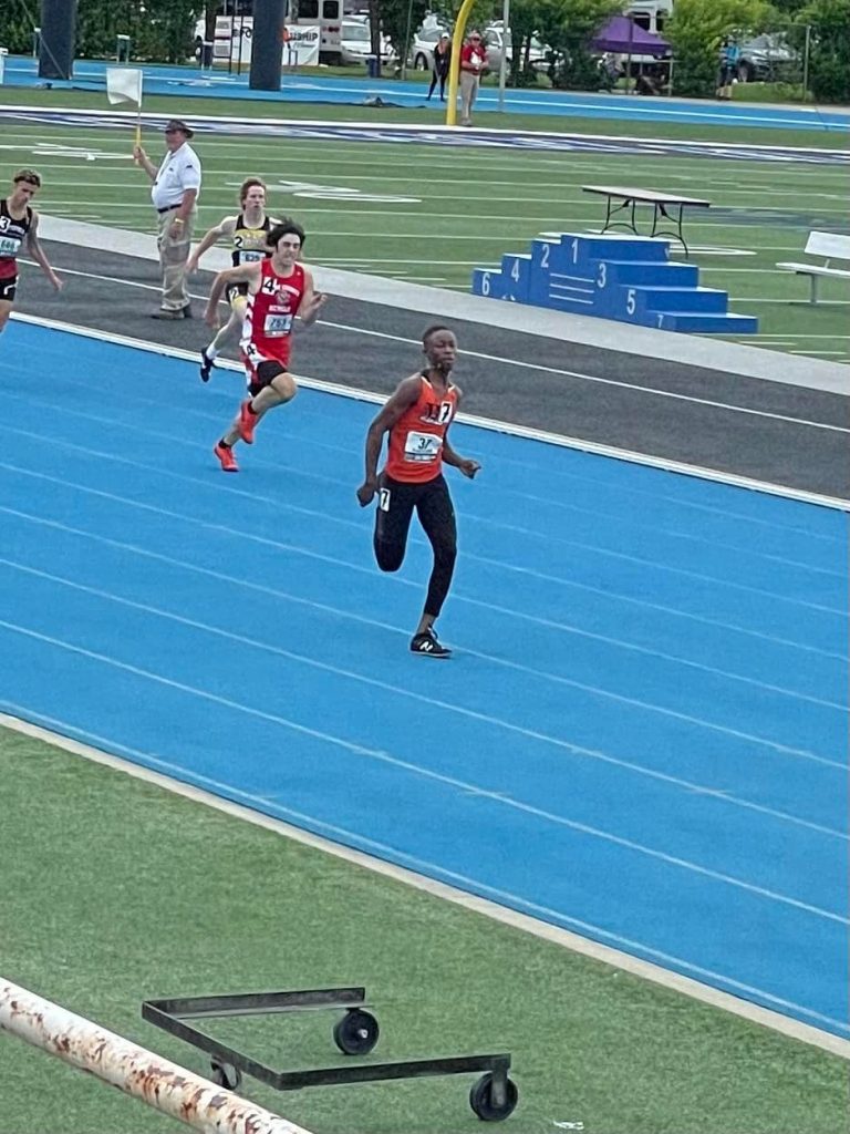 Beardstown Tiger Freshman Jean Luc Aplogan powers towards the finish line in his preliminary heat at the State Track and Field Finals.  Aplogan placed 8th in the 300 hurdles to earn a medal.