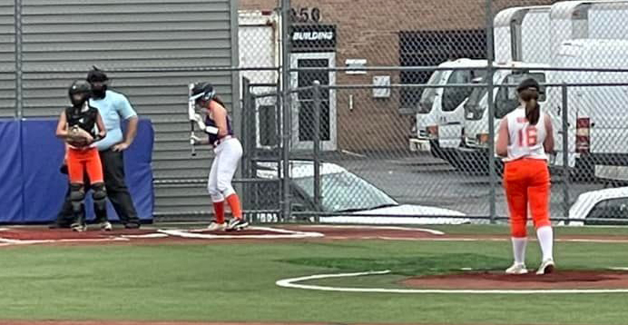 Khloe Kearns prepares to start her wind up as Ola Quigley looks to the dugout for the sign and the Plainfield batter steps into the box in 11/12 Year Old Girls State Tourney action.  A 3-1 win in a seven-inning thriller against Bi County and a 10 to zip pasting of Plainfield left the Tigers as one of the final two unbeaten teams in the tourney.