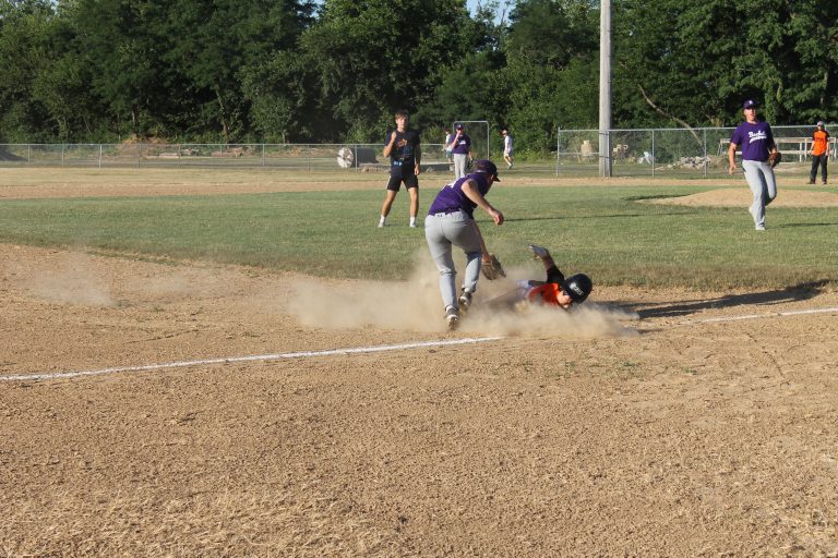 Beardstown's Trey Riddell is out in a cloud of dust trying to stretch a double into a triple at Ed Lewis Field in Junior League All Star action.