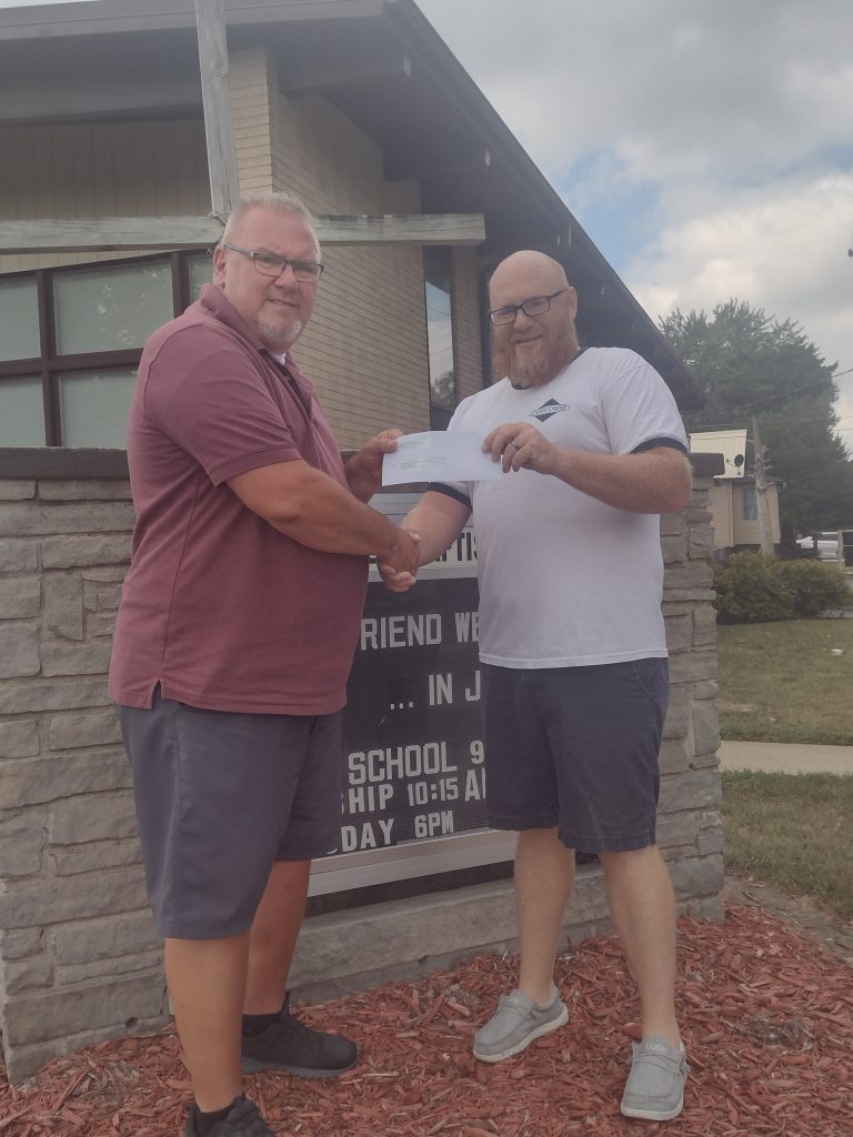 Pictured at right is Casey French, Marketing and PR Director at Cass Communications presenting a check to Pastor Daryl Vermillion (left) of First Southern Baptist Church Beardstown