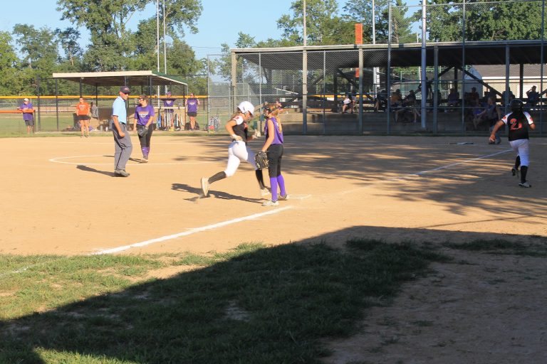 Harper Lawson heads for home as Ola Quigley rounds third on her way home in Beardstown’s junior high softball win over Rushville. Photo by Brockschmidt
