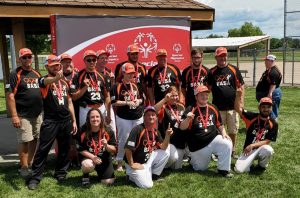 Pictured are the players and coaches for the Beardstown Area Special Athletes softball team following their Region H Championship victory.