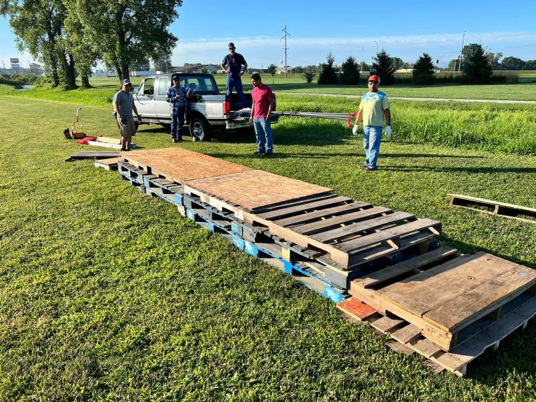 Beardstown Soccer Club volunteers set up the medal stand prior to the final regular season league games on July 30.  Thank you to all the volunteers who make our youth sports possible!