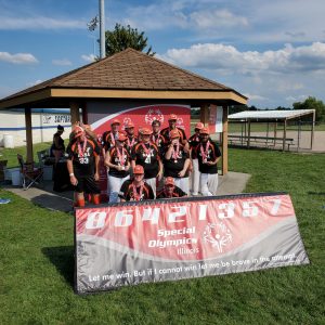 Pictured is the Beardstown Special Athletes Softball Team.  Back row (L/R): Jermey Gaines, Chad Bollinger, Doug Hance, Tanner Poppenhager, Wills Grosclade, Shawn Wubker.  Middle Row (L/R): Wes Parrish, Leah Mustard, Kloey Sarnecki, CJ Evans, Arturo Santamaria.  Front Row (L/R): Kelly Devlin, Ryan Peacock