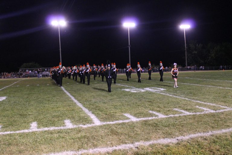 The BHS Marching Band performs at halftime of the opening home game of the football season.