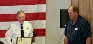 Chapin  Police Chief Steve Helmich receives the Purple Heart Award for being Injured in the line of Duty in March of this Year from Village President Rex Brockhouse