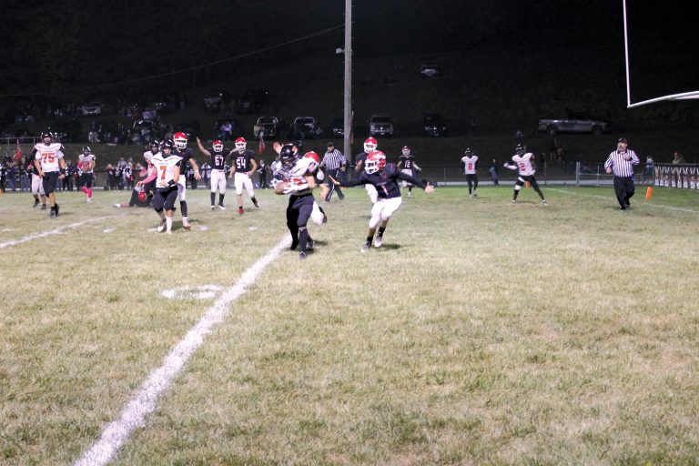 Ryan McClenning hauls in the 2-point conversion pass from Owen Quigley in the Tigers win at Hardin Calhoun.