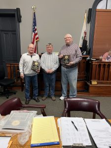 Bill Merriman (middle) presented Bob Schaefer (left) and Mike Barnett (right) with plaques for their service to Cass County. Shaefer served for 20 years and Barnett for 16 years.