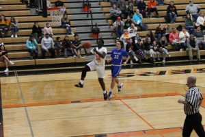 The Tiger's Chris Tchaklizo goes in for the layup in JV basketball action against PORTA AC Central