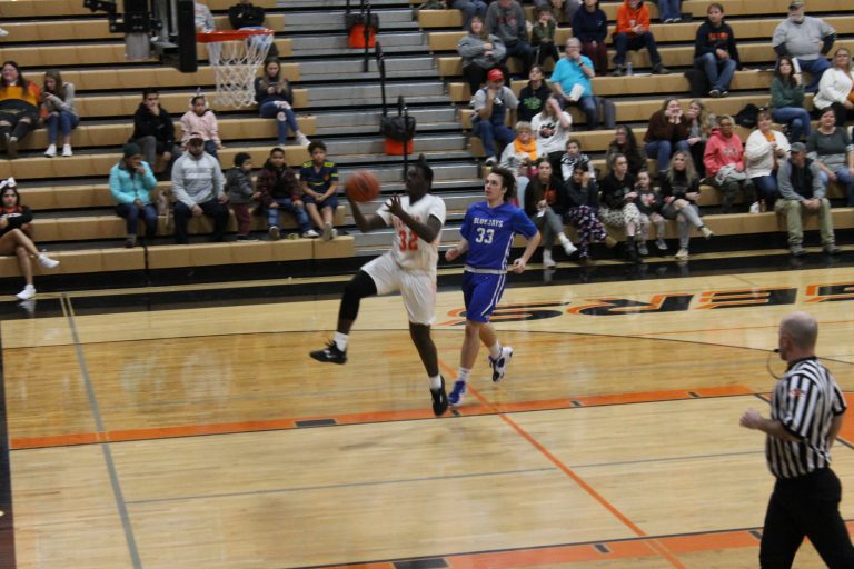 The Tiger's Chris Tchaklizo goes in for the layup in JV basketball action against PORTA AC Central
