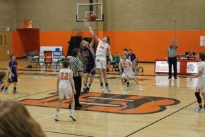 Beardstown’s Caleb Hobrock goes up high against a South Fulton Rebel at the opening tip of the eighth grade basketball game.