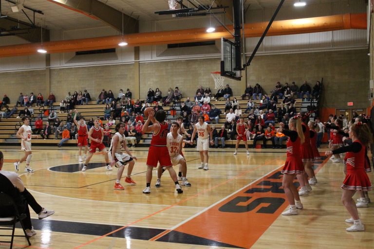 Parker McCoy and Ansgar Huhn (#33) trap in the corner in JV boys basketball action against Pittsfield.